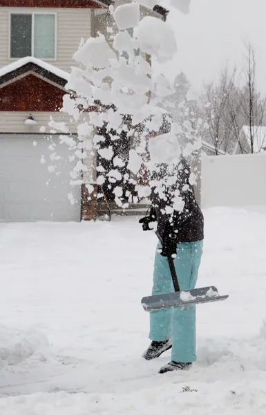 Snow nadrág a shoveling — Stock Fotó