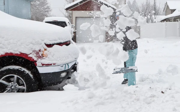 Snow pants shoveling — Stock Photo, Image