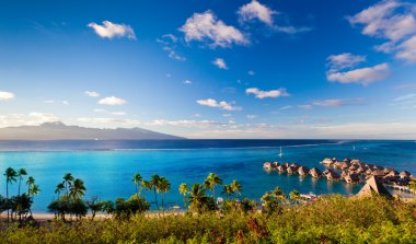 High angle shot over water bungalows at Moorea clipart