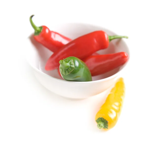 Traffic light chilly pepper in a small round white bowl, small — Stock Photo, Image