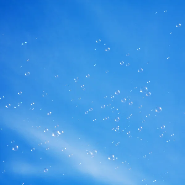 Bubbles on blue sky background — Stock Photo, Image