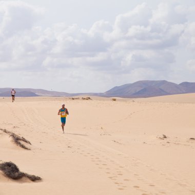 CORRALEJO - OCTOBER 30: Runners in the second half of the race, clipart