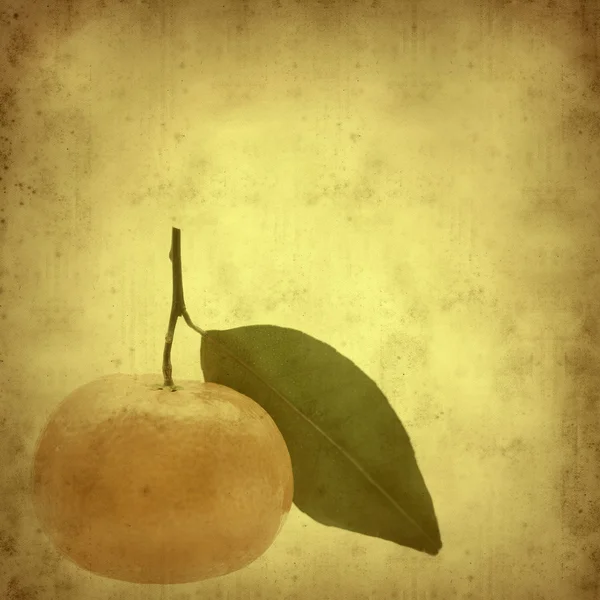 stock image Textured old paper background with mandarin fruit