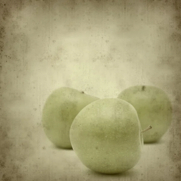 Stary tło z zielonym jabłkiem — Zdjęcie stockowe