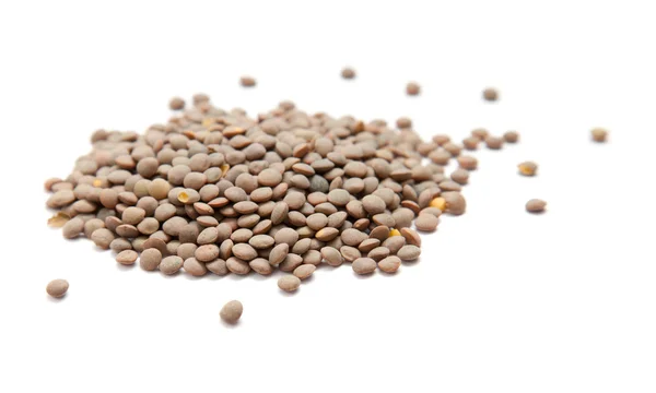 Handful of brown lentils isolated on white background — Stock Photo, Image