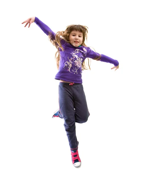 Маленька дівчинка, стрибки — стокове фото