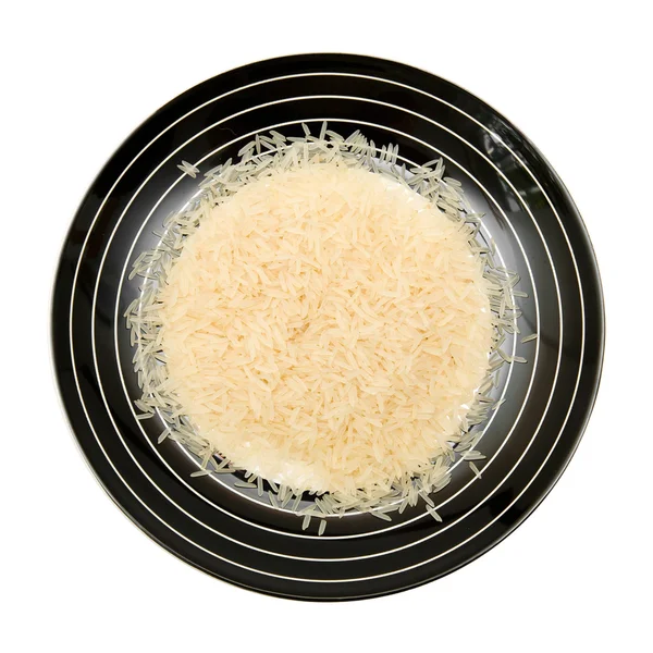 Jemné dlouhozrnné rýže na talíř černobíle pruhovaný — Stock fotografie