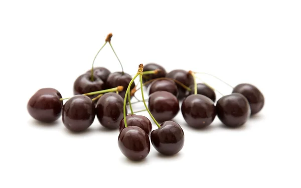 Handful of dark cherries isolated on white background — Stock Photo, Image