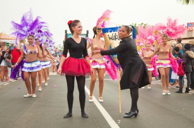 CORRALEJO - MARCH 17: School-age samba dancers taking part in Gr clipart