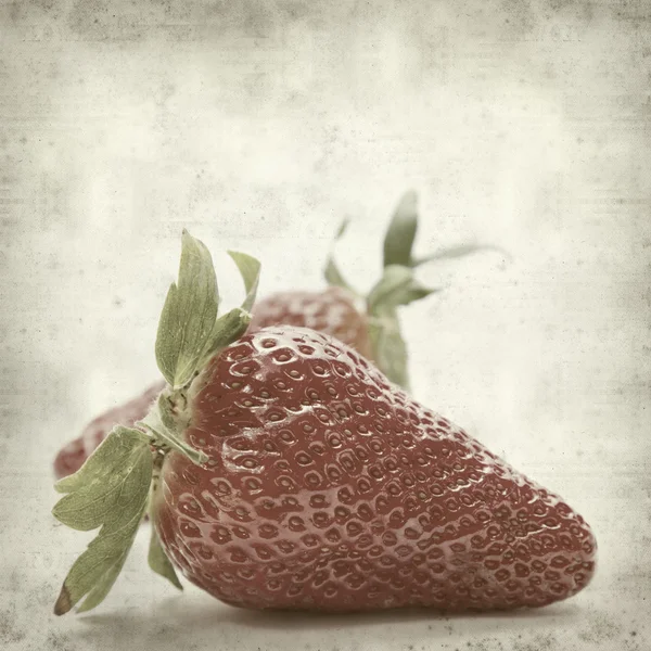 Texturerat gamla papper bakgrund med jordgubbe — Stockfoto