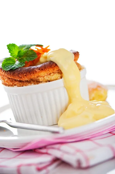 Cointreau or whiskey soufflé with orange, mint and vanilla sauc — Stock Photo, Image