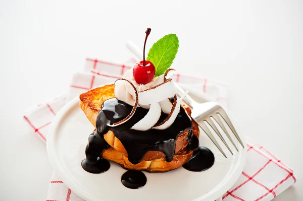 French toast with dark chocolate, white cream, red cherry, cocon — Stock Photo, Image