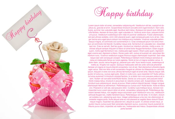 Un beau cupcake rose joyeux anniversaire avec une fleur et une étiquette — Photo