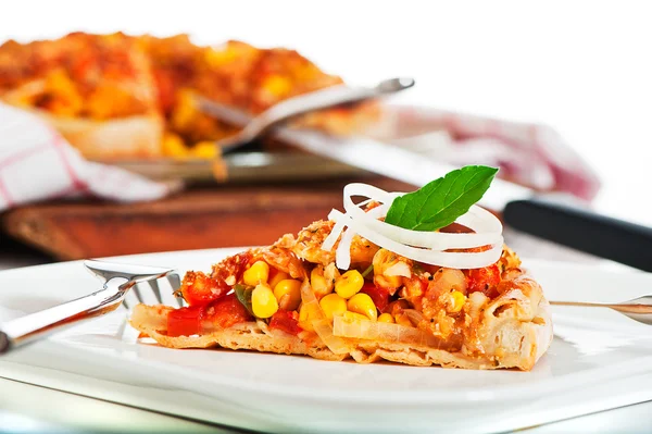 stock image A fresh homemade vegetarian pizza on white background as a studi