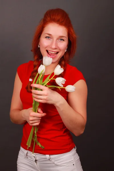 Happy girl with white tulips — Stock Photo, Image