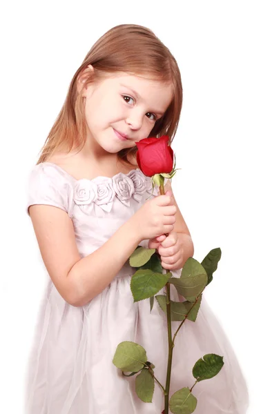 Holčička s červenou růží — Stock fotografie