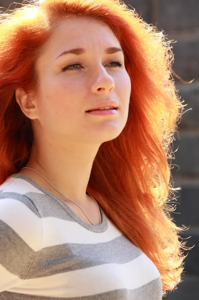 Young woman in sun lights — Stock Photo, Image