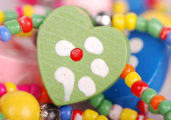 Colorful round and heart-shaped beads — Stock Photo, Image