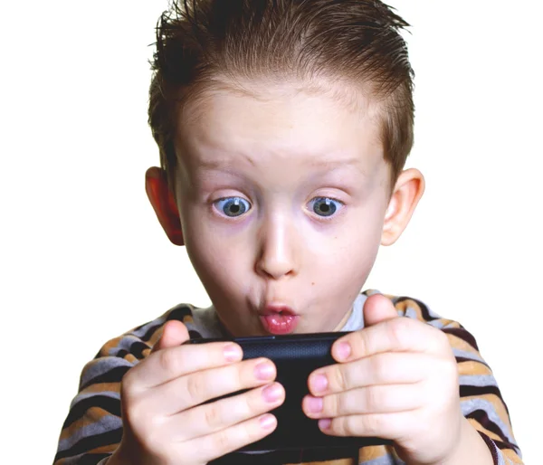 The boy was surprised to look in the phone — Stock Photo, Image