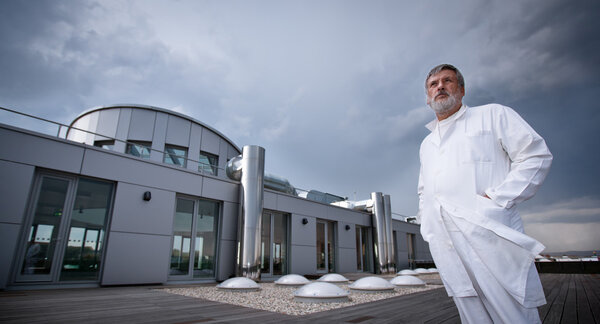 Renowned scientist/doctor standing on the roof