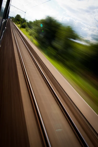 Railroad seen from a fast moving train. Stock Photo