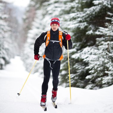 Cross-country skiing: young man cross-country skiing clipart