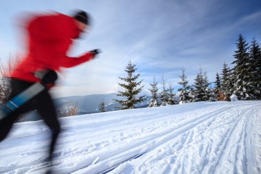 Cross-country skiing: young man cross-country skiing clipart