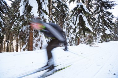 Cross-country skiing: young man cross-country skiing clipart