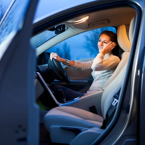 Pretty young woman driving her brand new car — Stock Photo, Image