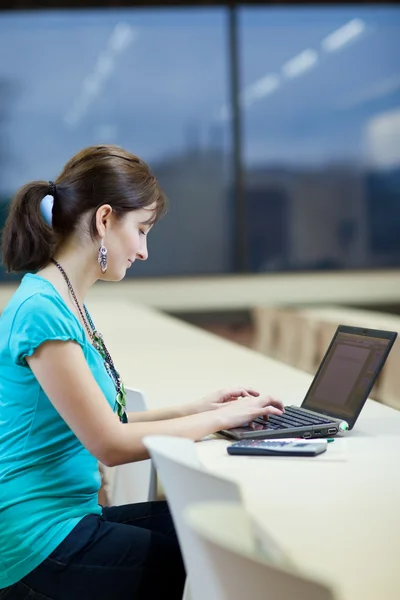 Pretty young female student with laptop on university campus — Stock Photo, Image