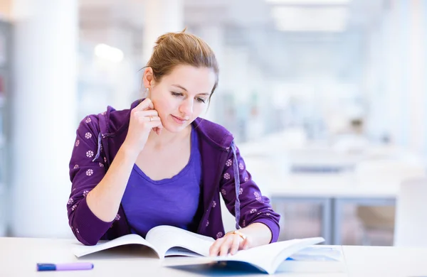Female college student in a library Stock Photo