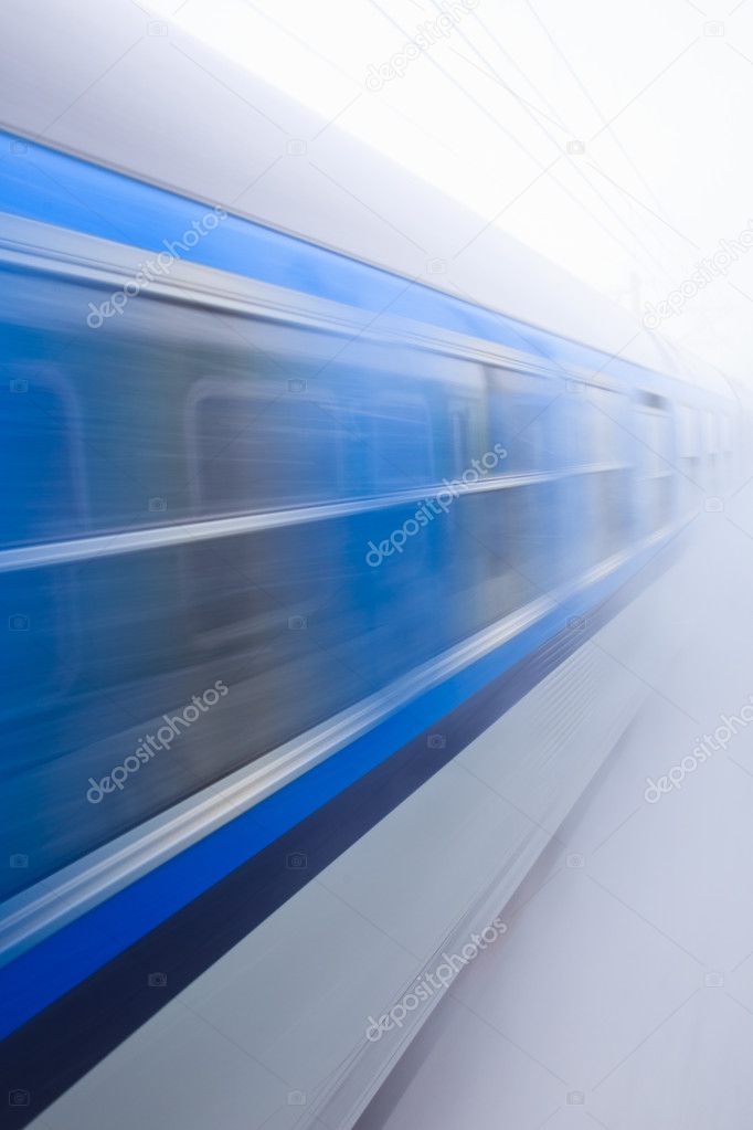 Train going fast in a snow storm