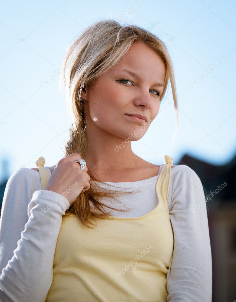 Closeup portrait of a beautiful young woman outdoor