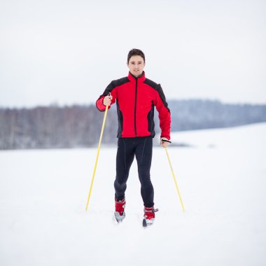 Cross-country skiing: young man cross-country skiing clipart