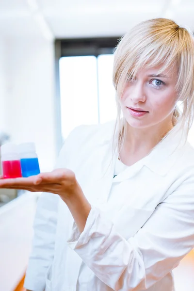 Close up of a female researcher / chemistry student — стоковое фото
