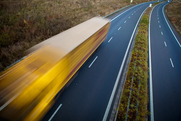 Highway traffic - motion blurred truck on a highway/motorway — Stock Photo, Image