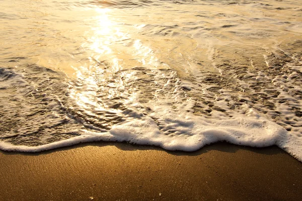 Хвиля під заходом сонця для фонового використання — стокове фото