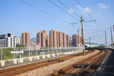 Tuen Mun downtown and railway of light rail clipart