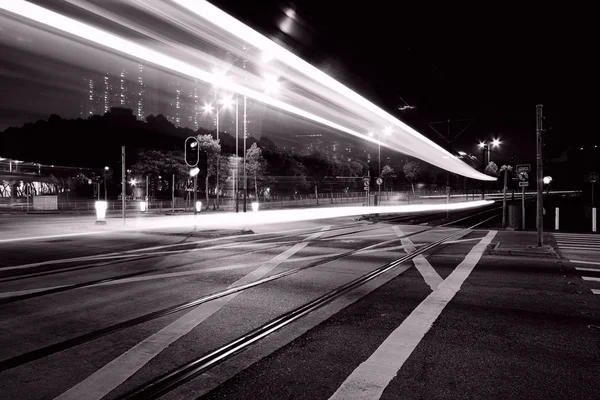 Traffic through downtown of Hong Kong at night in black and whit — Stock Photo, Image