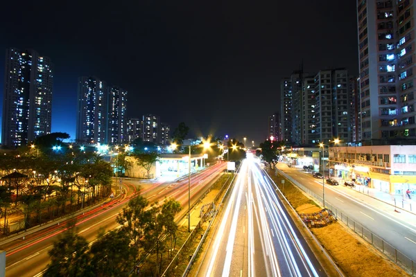 Modern city and traffic at night — Stock Photo, Image