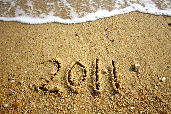2011 written on sand — Stock Photo, Image