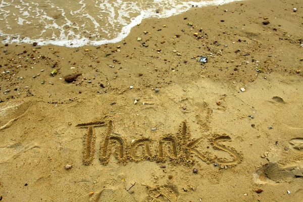 stock image Thanks words on sand