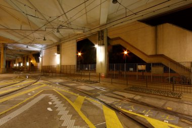 Light rail station at night clipart