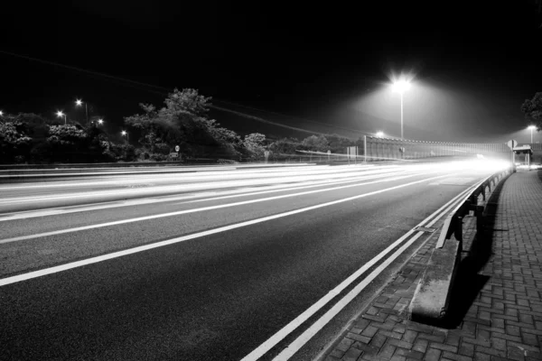 Traffic in modern city in black and white tone — Stock Photo, Image