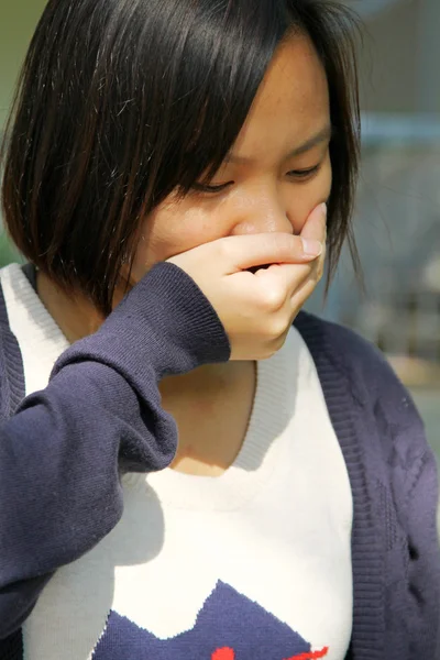 Asian woman sneezing — Stock Photo, Image