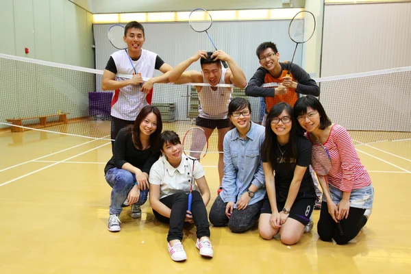 Asian friends playing badminton — Stock Photo, Image