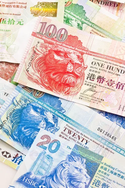 Moneda de Hong Kong con diferentes dólares de fondo — Foto de Stock