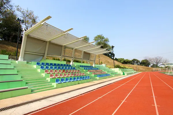 Stadium seats and running track — Stock Photo, Image