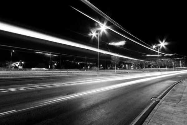 Traffic in city in black and white toned