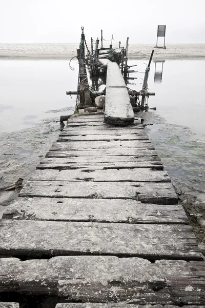Desolated wooden pier in low saturation — Stock Photo, Image